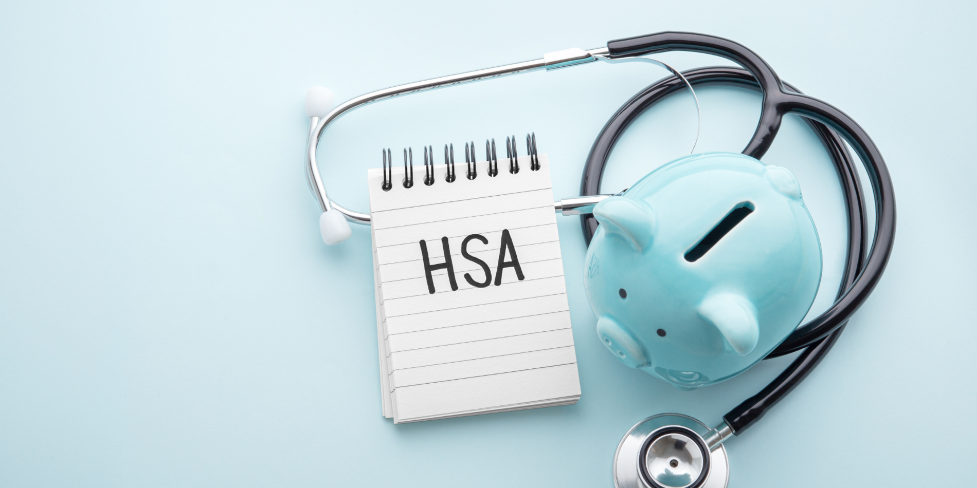 Blue piggy bank with notepad that has "HSA" written on it
