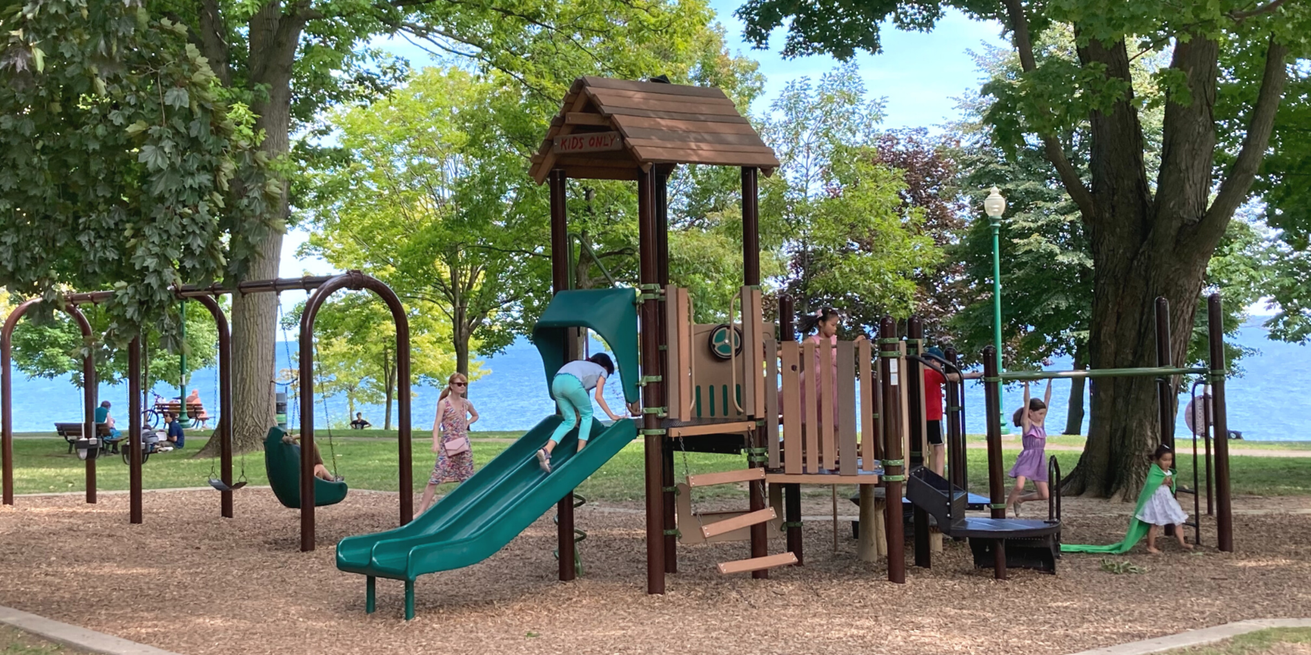 Children playing on play structure in public park