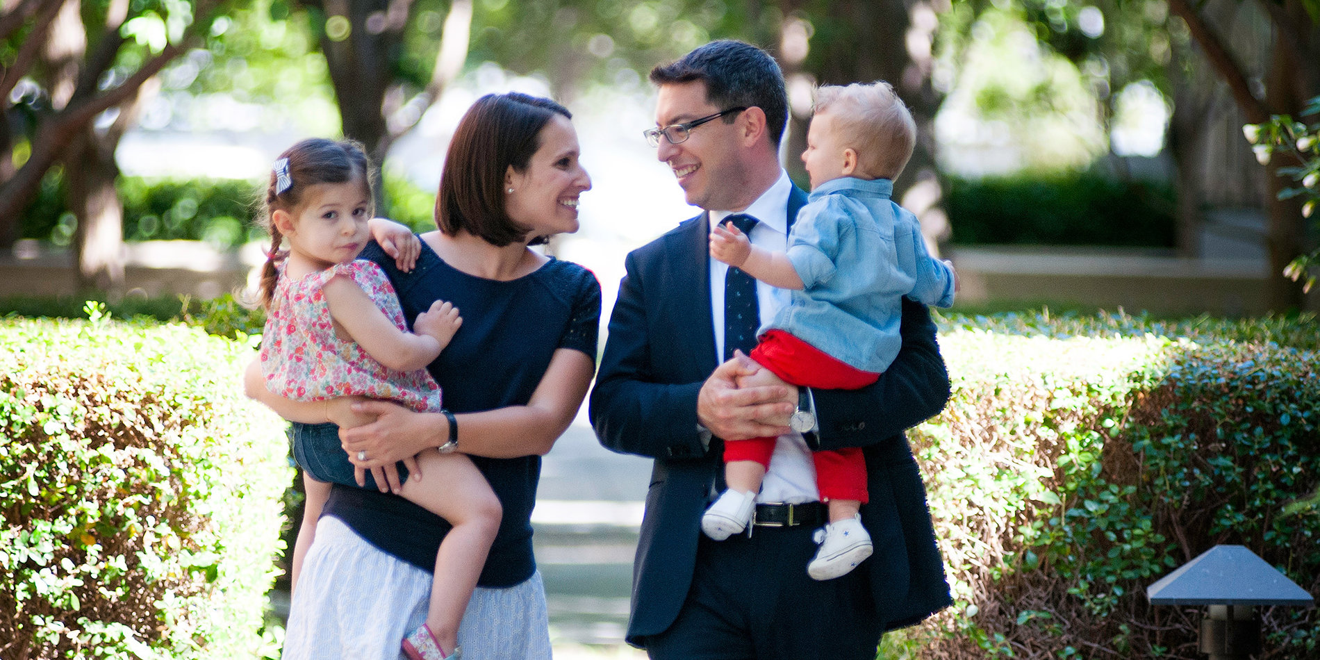Dan Azagury and his wife holding their two kids