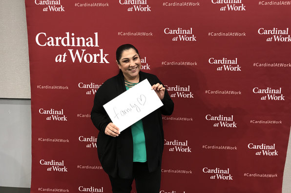 Stanford employee on cardinal at work backdrop