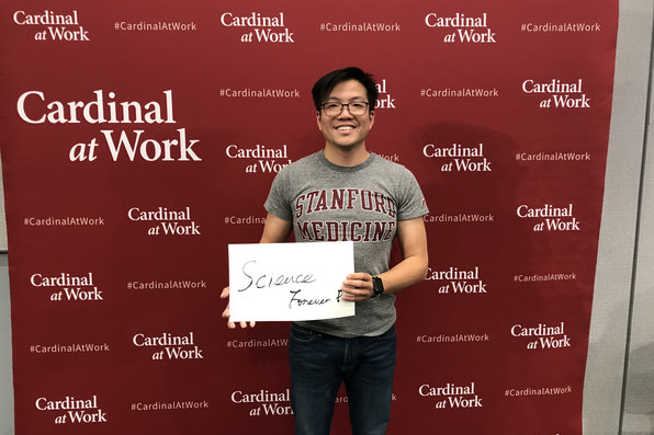 Stanford employee on cardinal at work backdrop