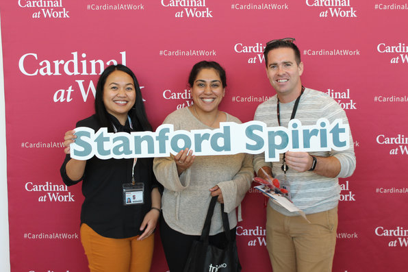 Stanford employees on cardinal at work backdrop