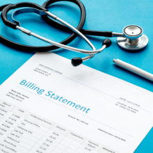 medical treatment bill, calculator and phonendoscope on blue background