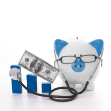 Blue piggy bank wearing glasses and stethoscope 